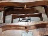 a wooden box with a key inside of it