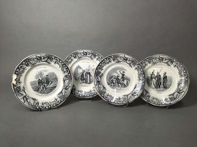 four black and white plates with a picture of people on them