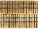 a pile of old books stacked on top of each other
