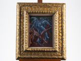 une photo d'un tableau accroché à un chevalet en bois