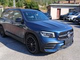 the mercedes gle is parked in a parking lot with other cars in the background