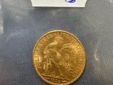 a close up of a gold coin with a label on it