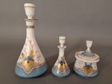 three vases that are sitting on a table