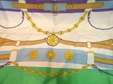 a scarf with a bunch of belts and chains on it