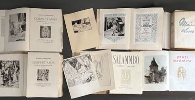 several old books are lined up on a black table