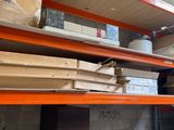 many boxes and boxes on the shelves in the room