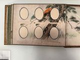 a picture of an open book with a picture of a bird on it
