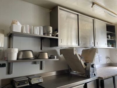 a kitchen with stainless steel cabinets and a stove