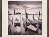 a picture of a black and white picture of boats on the water