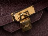 a close up of a purse with a padlock on it