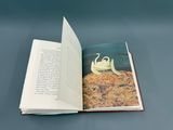an open book with a picture of a crab on it