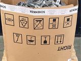 a cardboard box that has a bunch of metal items in it