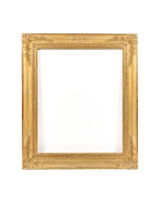 a gold frame on a white wall with a white background
