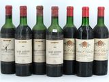 six bottles of wine are lined up in a row
