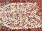 an image of a close up of a paisley pattern on a table cloth