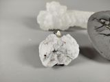 a small rock with a small piece of rock on it