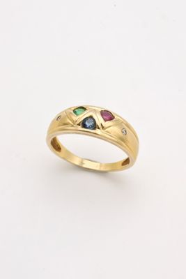 a yellow gold ring with three different colored stones