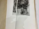 an open book with a drawing of a woman ' s face on it