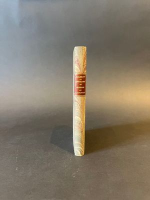 a close up of a cigar sitting on top of a table