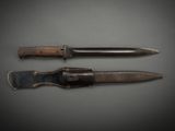 two knives that are sitting next to each other on a table
