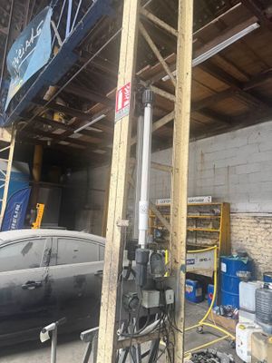 an image of a car parked in a garage under construction