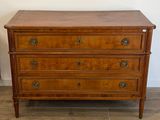 an image of a wooden chest of drawers on a hard wood floor
