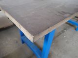 a close up of a piece of wood on a workbench