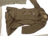 an image of a brown jacket on a white surface