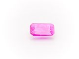 a pink sapphire stone on a white background