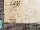a piece of fabric that has been stitched together with a piece of paper