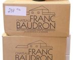 boxes stacked on top of each other with a bottle of wine on top of them