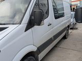 a white van parked in front of a building