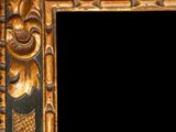 an ornate gold frame with a black background and a black background