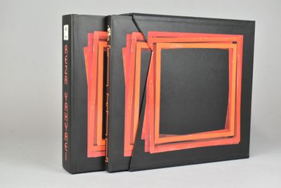 an orange and black book with a picture of a picture in the middle