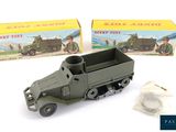 toy army vehicles are sitting in front of a boxed box