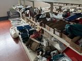many boxes of clothing on the shelves in the room