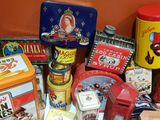 many different types of tins and tin cans on the table