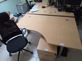 a desk with a chair and a computer monitor on it