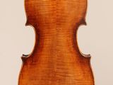 an old violin with a wooden back and a long neck