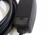 a black power cord that is connected to a black charger