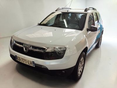 a picture of a white car parked in a garage