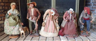 five figurines of people standing on a porch