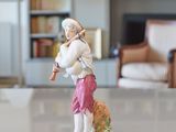 a figurine of a man playing a flute in a living room