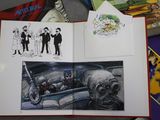 a book with a picture of a group of people in a car