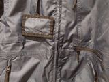 the back of a blue jacket with a zippered pocket on a mannequin mannequin mannequin mannequin mannequin mannequin mann