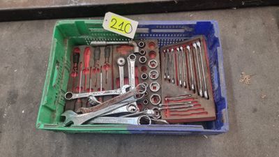 a box full of tools sitting on the floor