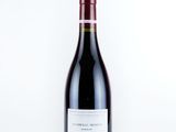 a bottle of wine that is sitting on a table
