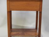 a small wooden table with a shelf on top of it