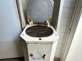 a white toilet sitting in a bathroom next to a door