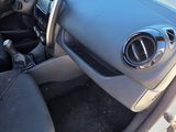 the interior of a small car with black leather seats and a steering wheel